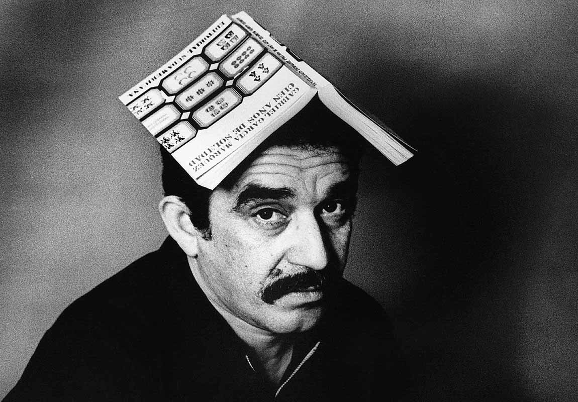 Gabriel Garcia Marquez with Book on Head