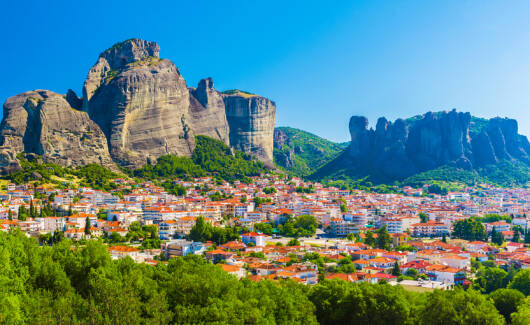 Kalampaka town with Metora cliffs and monastery, Greece.